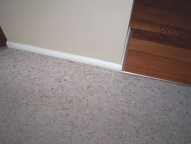 An image showing the repaired carpet runner on stairs.