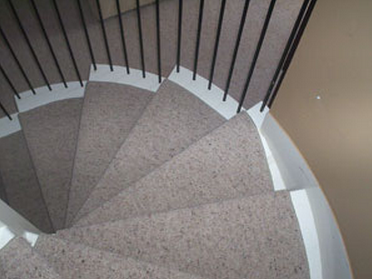 3. Another image showing a carpet runner on stairs after repairs.